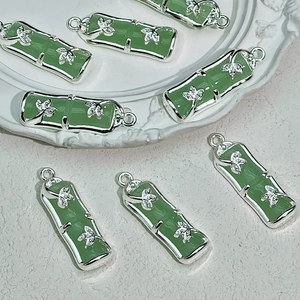 Bamboo joint pendant in green faux jade with silver butterfly accent for DIY jewelry