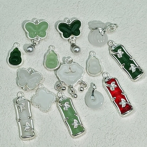 Traditional Chinese style faux jade and glass pendants with silver-plated bamboo and floral motifs