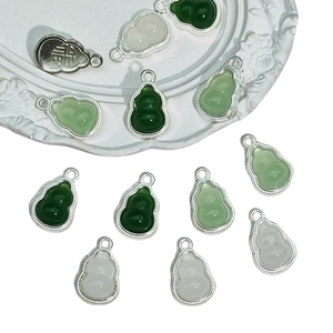 Gourd charms in dark green, light green, and white stone finishes with silver metal frames