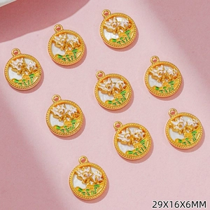 Macro view of Chinese style round lotus flower charms in gold and white enamel