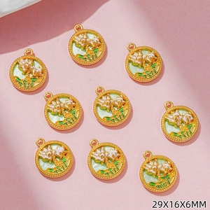 Detail of enamel lotus charms with gold beaded edges for DIY jewelry making 29x16mm