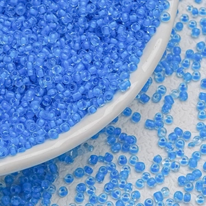 Close-up of 3mm light blue glass seed beads for DIY handmade jewelry and earring making
