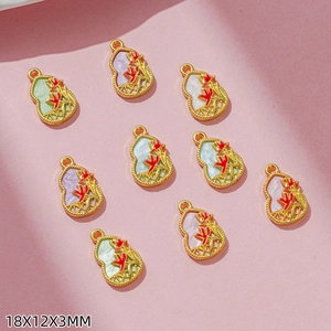 Macro shot showing multi-colored enamel gourd pendants with gold floral details