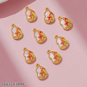 Detailed view of nine gold-plated gourd pendants with floral patterns and pearl finish