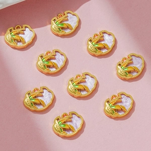 DIY corn pendants with gold metal frames and green enamel for jewelry making