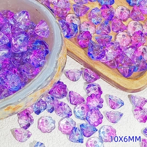 Close-up of 10x6mm gradient purple and blue glass lotus seed pod beads for DIY crafts