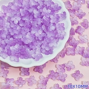 Macro view of 10mm light purple Czech glass flower beads with ice crack texture detail