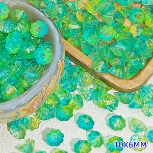 Macro shot of 10x6mm translucent green gradient lotus flower beads for DIY jewelry