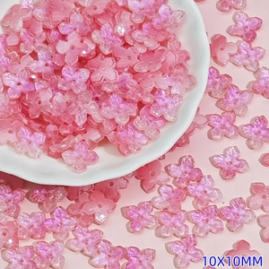 Macro view of 10mm pink glass flower beads for DIY jewelry making and handmade crafts