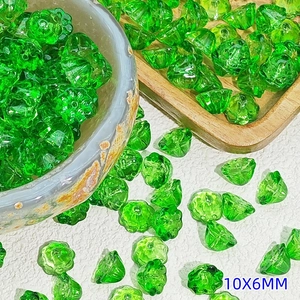 Macro shot of 10x6mm green glass lotus flower beads for DIY jewelry making