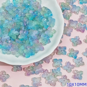 Macro detail of 10mm gradient Czech glass flower beads for DIY jewelry making