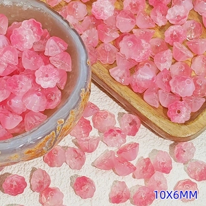 Close-up of 10x6mm pink glazed lotus petals beads for DIY jewelry and hair accessories