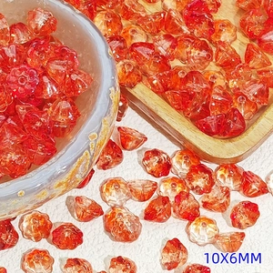 Macro detail of 10x6mm orange lotus-shaped glass flower beads for DIY jewelry making