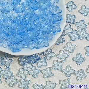 Macro view of 10mm light blue Czech glass flower beads for DIY jewelry making
