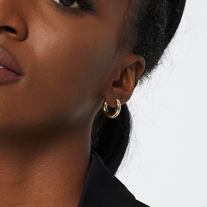 Polished 18K gold-plated minimalist hoop earrings on model for daily casual style