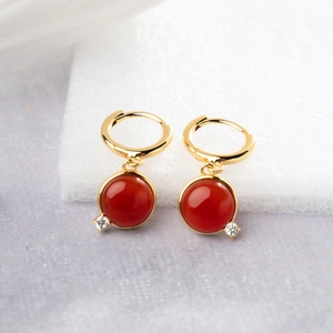 Fashionable geometric gold earrings with red round natural stone and small diamond accents