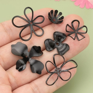 Black metal flower charms for DIY jewelry making in various floral shapes and sizes