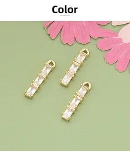 Close-up of 18k gold plated bamboo-style pendant with sparkling zircon inlays