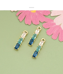 Detailed view of 18k gold plated bamboo pendants with gradient zircon stones for DIY jewelry