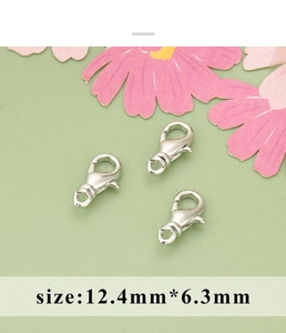 Macro view of 12.4mm silver lobster clasps for DIY jewelry making and necklace assembly