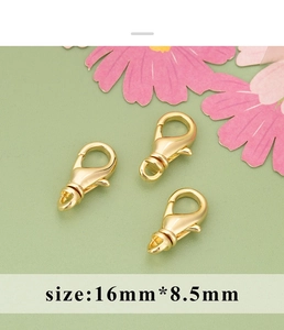 Detailed macro view of gold lobster clasp connector for DIY pearl necklaces 16mm