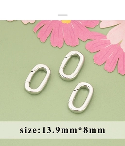 Macro view of 13.9x8mm silver oval lobster clasp connectors for DIY jewelry making
