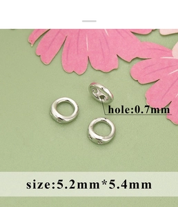 Detailed view of silver jewelry connectors for DIY necklaces with 0.7mm hole size