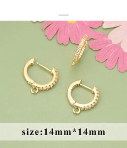 Close-up of 18K gold plated earring hoops with cubic zirconia and 14mm hanging loops