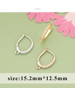 Close-up of diamond-set gold and silver earring hooks for DIY jewelry making