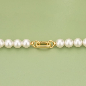Gold-plated pearl necklace connector with toggle clasp and twisted rope ring details