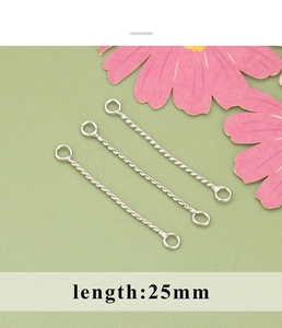 Detail view of three silver 25mm twisted metal link connectors for DIY jewelry making