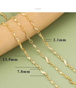 Detailed view of 18k gold plated twisted wave chain links with 2.1mm measurement