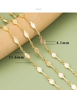 Macro detail of 18k gold-plated geometric link chain measuring 11.6mm by 4.1mm