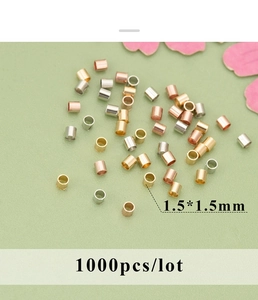 Detailed macro view of 1.5x1.5mm 18K gold plated copper crimp tubes for DIY jewelry