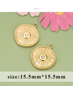 Detailed macro view of gold-plated sunburst flower charms with sizes 15.5mm by 15.5mm