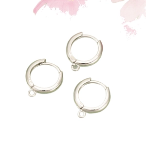 Polished silver DIY hoop earrings with attachment loops on white floral background