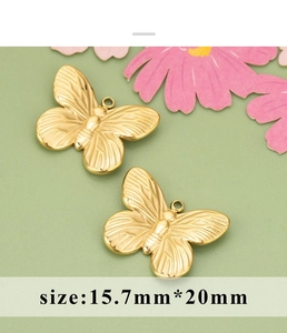 Detail of 15.7x20mm golden butterfly pendant with fine striped engraving for DIY jewelry