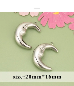 Detailed view of silver moon face charms for jewelry making measuring 20mm by 16mm