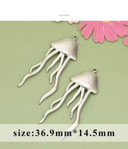 Macro shot of silver jellyfish pendants for DIY jewelry making size 36.9mm by 14.5mm