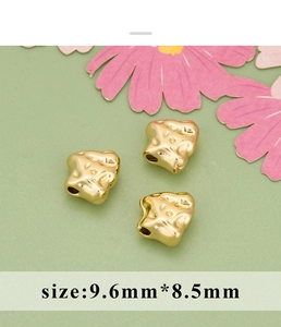 Macro detail of three irregular baroque 18K gold-plated beads, 9.6mm by 8.5mm DIY beads