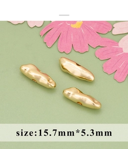 Detailed macro of 18K gold irregular baroque long beads for DIY jewelry making