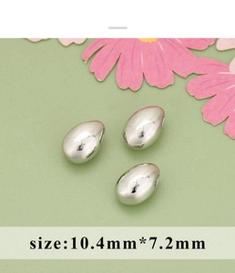Close-up of silver-plated irregular teardrop beads with 10.4mm by 7.2mm dimensions