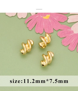Macro detail of 18K gold-plated spiral beads measuring 11.2mm by 7.5mm for DIY jewelry