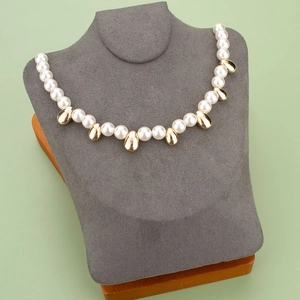 Elegant 18K gold plated baroque pearl necklace displayed on a premium grey velvet bust stand