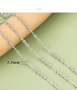 Macro shot showing 3.3mm silver flower bead chain detail for DIY necklace jewelry