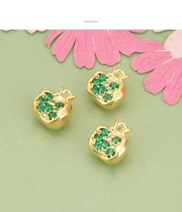 Detail of 18K gold plated pomegranate charms with green zircon pave setting for DIY jewelry