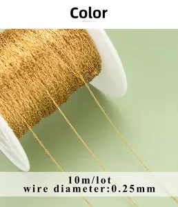 Macro view of 0.25mm gold stainless steel jewelry chain on roll for DIY craft