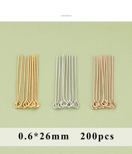 Macro view of 0.6x26mm metal eye pins in gold, silver, and rose gold finishes