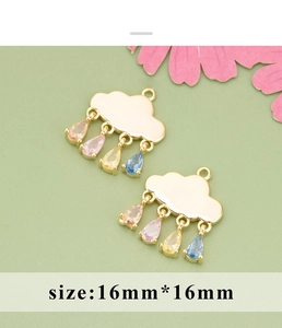 Close-up of gold cloud pendants with colorful pear-cut zircon drops for jewelry DIY