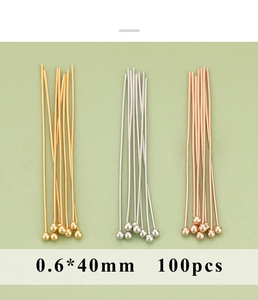 Macro detail of 0.6x40mm metal ball pins in gold, silver, and rose gold for jewelry making